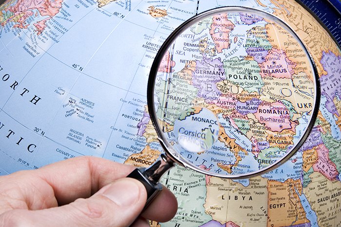 magnifying glass on globe