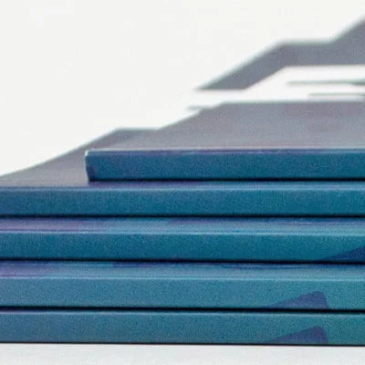 Close up shot of 5 perfect binding printed notebooks stacked