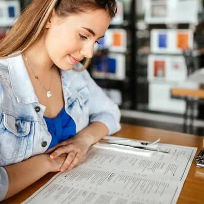 Fundraising Print 13 woman reading a printed restaurant menu