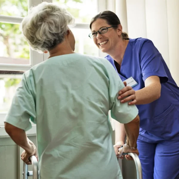 Healthcare Services 1 nurse at care home looking after a patient with a printed badge